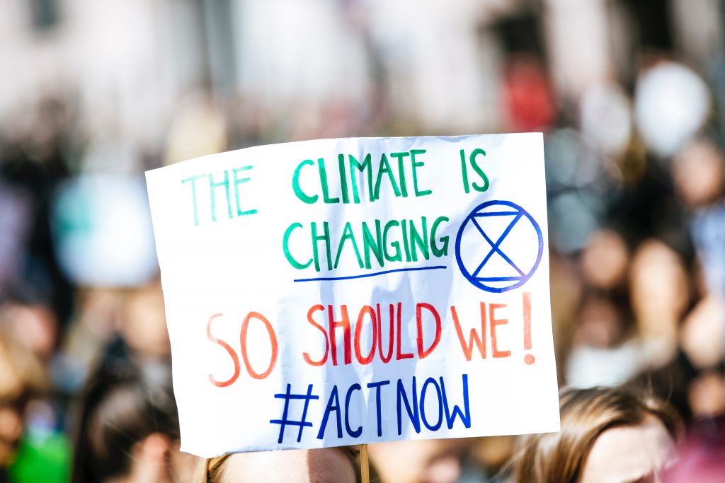 The text in the image reads, "The Climate is Changing. So, should we! #Actnow" 